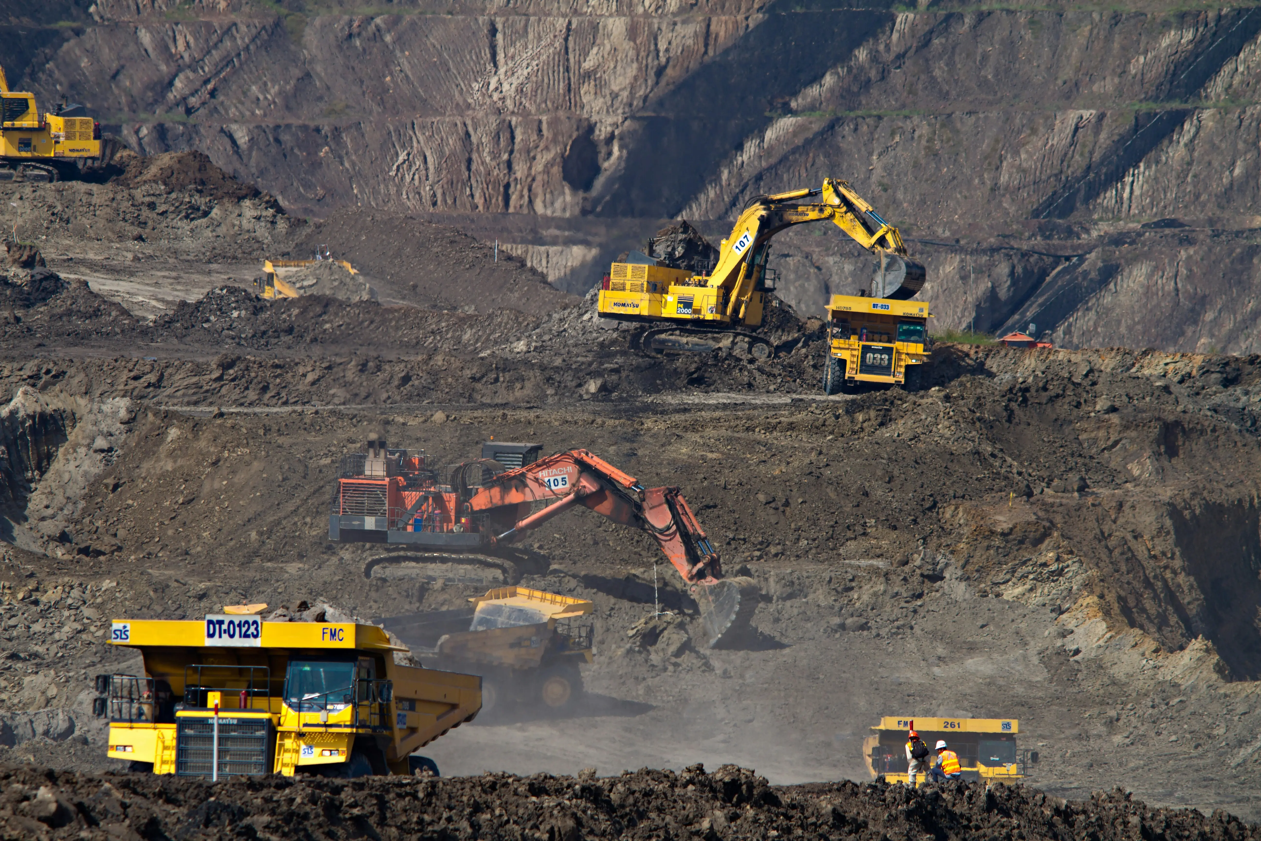 Ultra-class haul trucks at an open pit mine